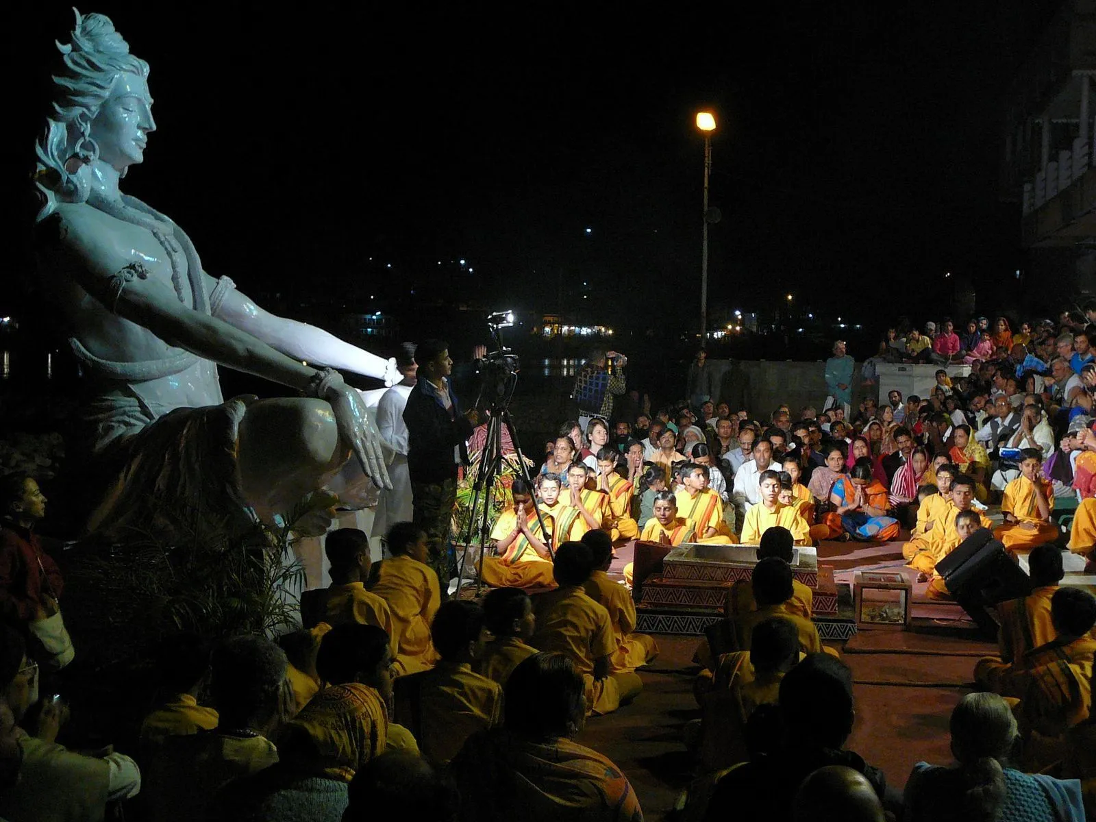 Rishikesh Ganga Aarti at sunset with devotees and lamps during a sightseeing tour