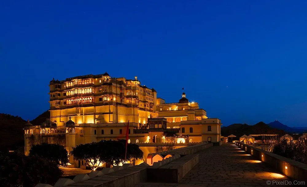 Devigarh Palace illuminated by evening lights showcasing restored heritage architecture in Delwara, Rajasthan