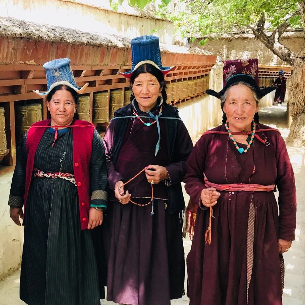 Traditional Ladakhi lama women near Alchi Monastery in Ladakh wearing colorful Himalayan clothing