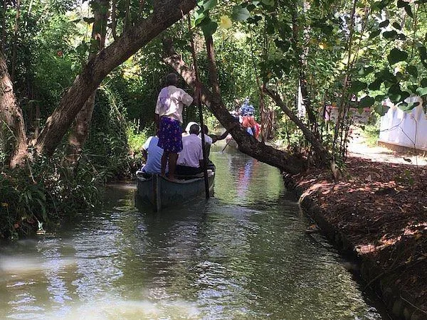Munroe Island backwaters with traditional canoe in Kerala